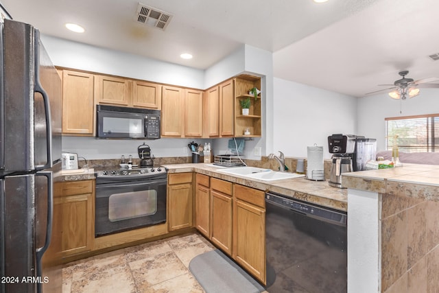 kitchen featuring sink, black appliances, kitchen peninsula, and ceiling fan