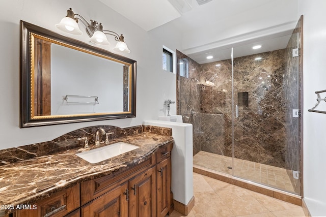 bathroom featuring vanity, tile patterned floors, and a shower with door