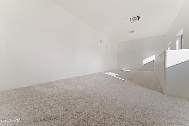 spare room featuring carpet