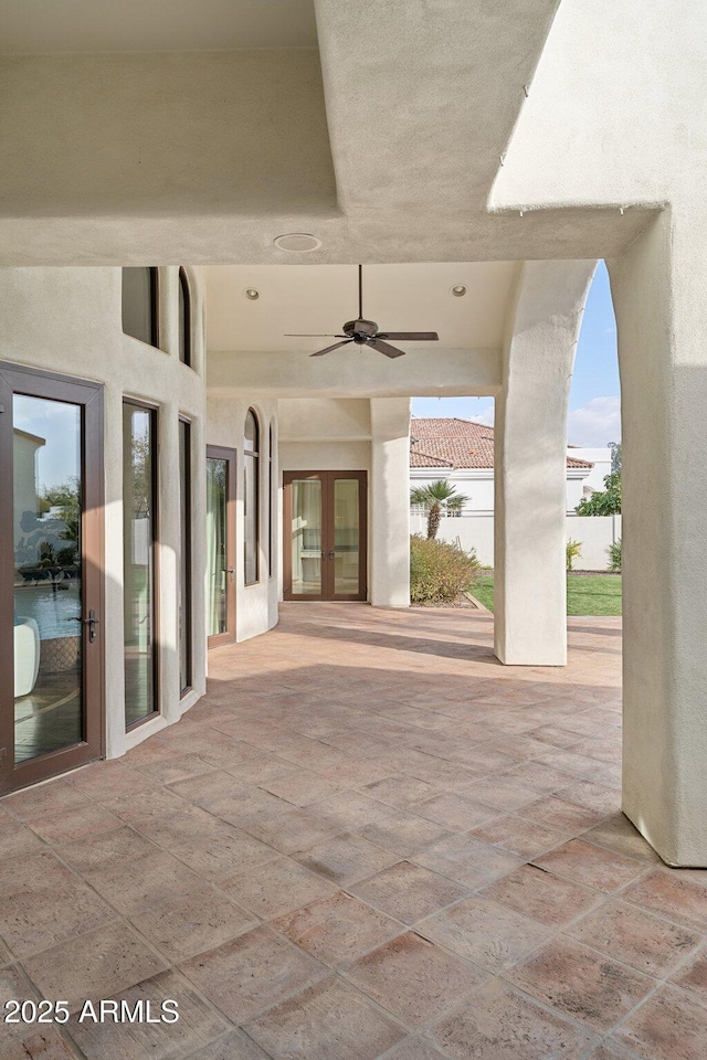 view of patio / terrace with ceiling fan and french doors