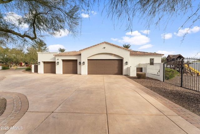 mediterranean / spanish house featuring a garage