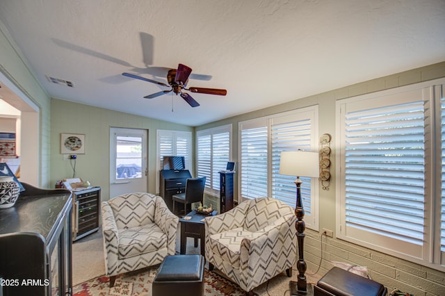 interior space with a textured ceiling, ceiling fan, vaulted ceiling, and wine cooler