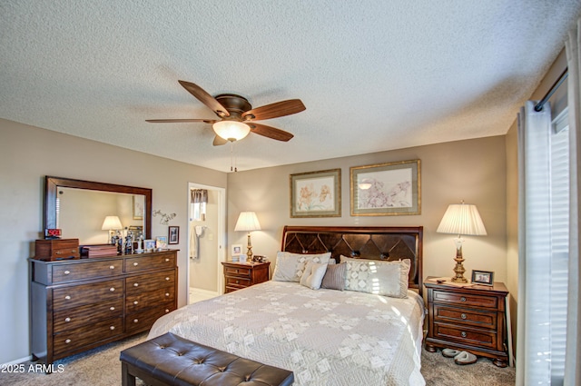 carpeted bedroom featuring a textured ceiling, ceiling fan, and connected bathroom