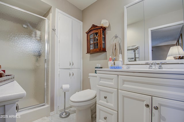 bathroom featuring sink, an enclosed shower, and toilet