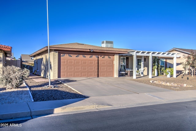 ranch-style house featuring cooling unit and a garage