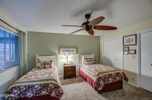 bedroom with ceiling fan, a closet, carpet floors, and a textured ceiling