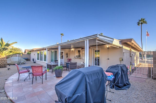 rear view of house with a patio