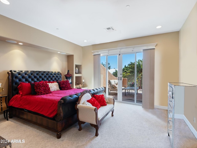 carpeted bedroom featuring french doors and access to outside