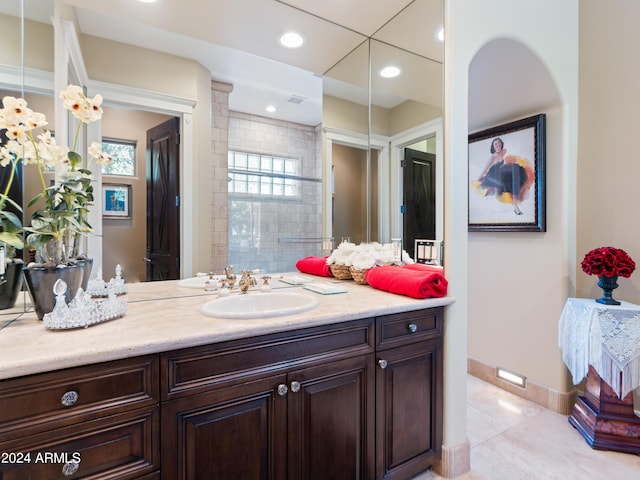 full bathroom featuring tile patterned floors, recessed lighting, baseboards, and vanity