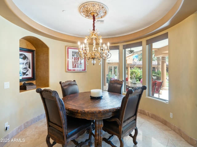 dining area featuring baseboards, visible vents, and light tile patterned flooring