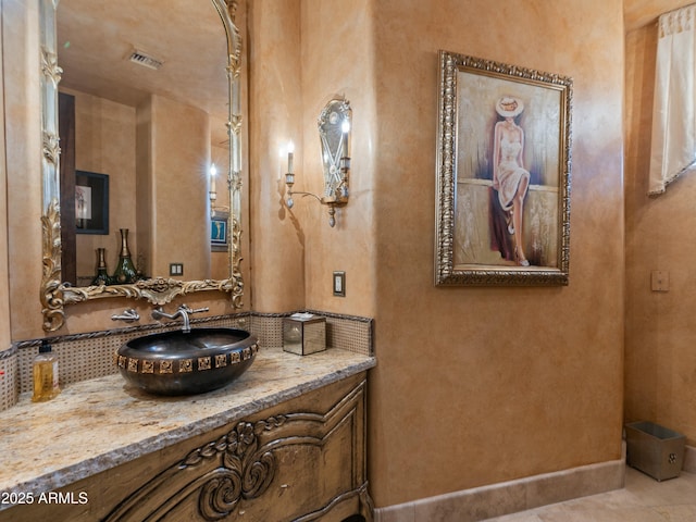 bathroom featuring visible vents and vanity