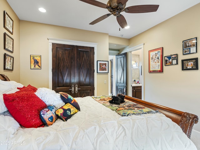 bedroom featuring ceiling fan, ensuite bath, and recessed lighting