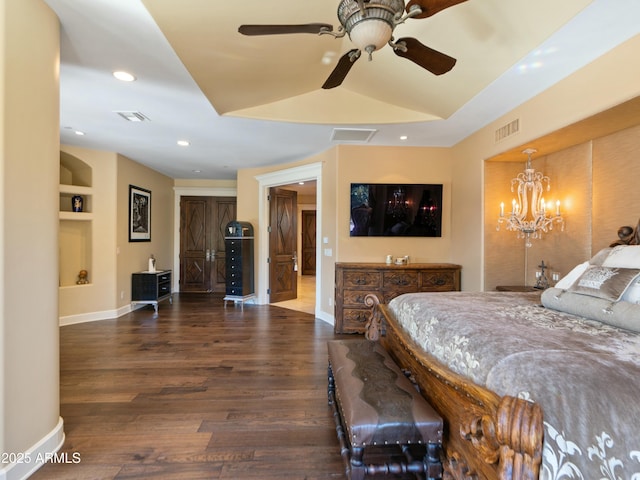 bedroom with dark wood-style floors, visible vents, and baseboards