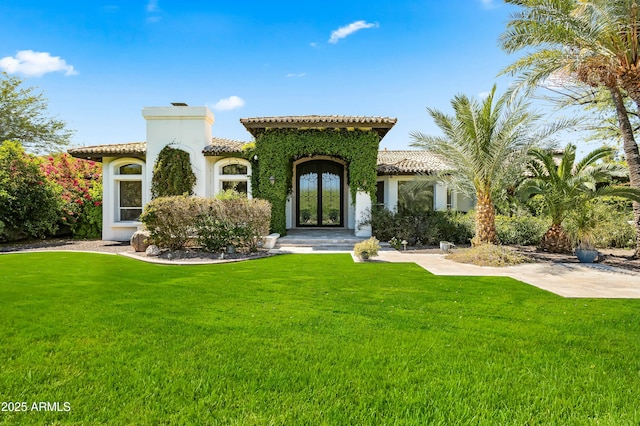 5740 N Casa Blanca Dr, Paradise Valley, AZ 85253 - mediterranean / spanish-style house with a front yard, stucco siding, a tiled roof, and a chimney