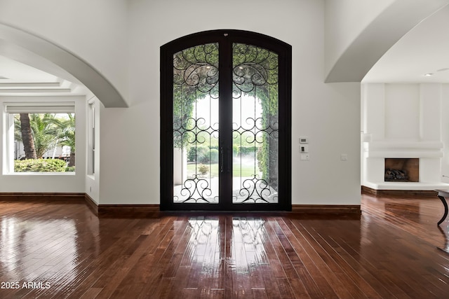 5740 N Casa Blanca Dr, Paradise Valley, AZ 85253 - entryway with french doors, baseboards, arched walkways, and hardwood / wood-style floors