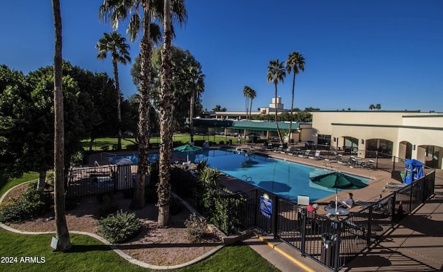 view of swimming pool with a patio area