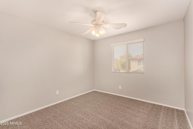 spare room with carpet floors and ceiling fan