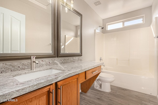 full bathroom with vanity, toilet, and bathing tub / shower combination