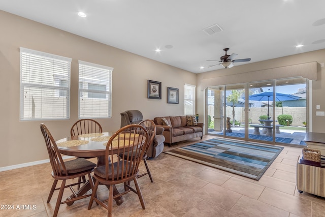 tiled dining room with ceiling fan