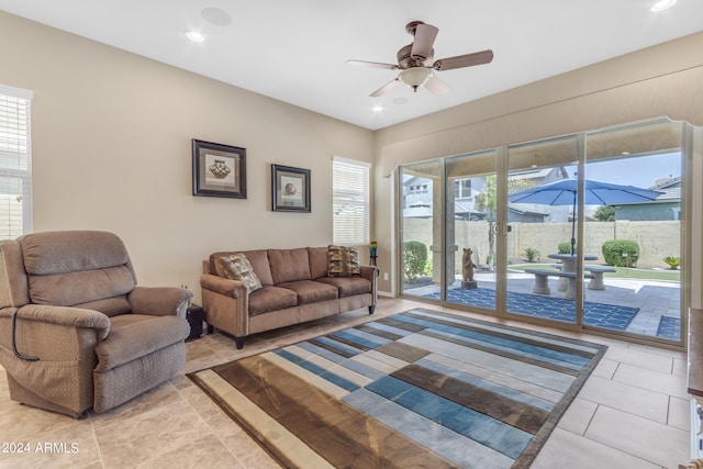 living room with light tile patterned flooring and ceiling fan