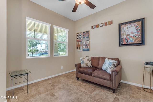 sitting room with light tile patterned flooring and ceiling fan