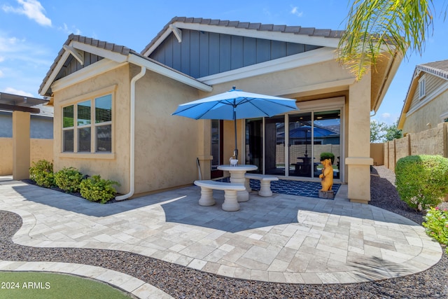 rear view of property with a patio area