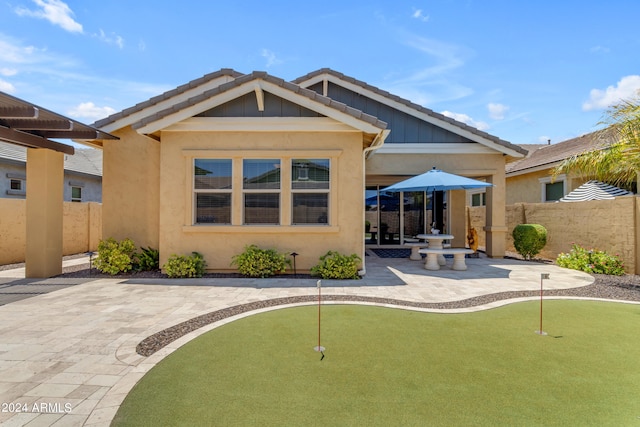 back of house with a patio area