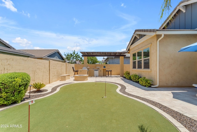 view of yard with a pergola and a patio area