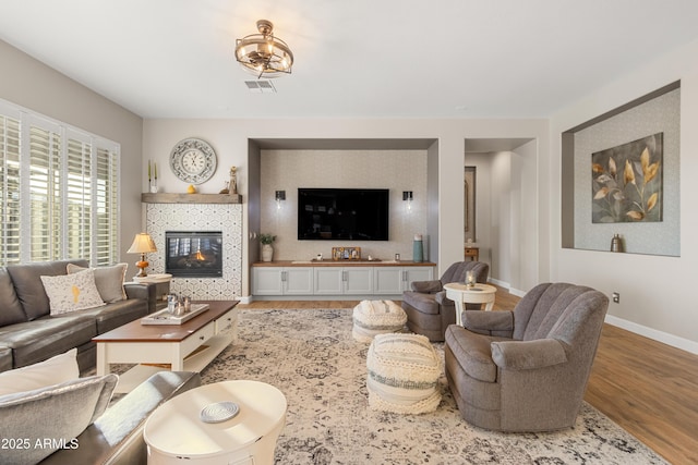 living room with light hardwood / wood-style flooring