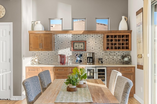 interior space with wine cooler and light wood-type flooring