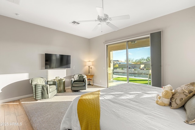 bedroom with access to exterior, ceiling fan, and light wood-type flooring