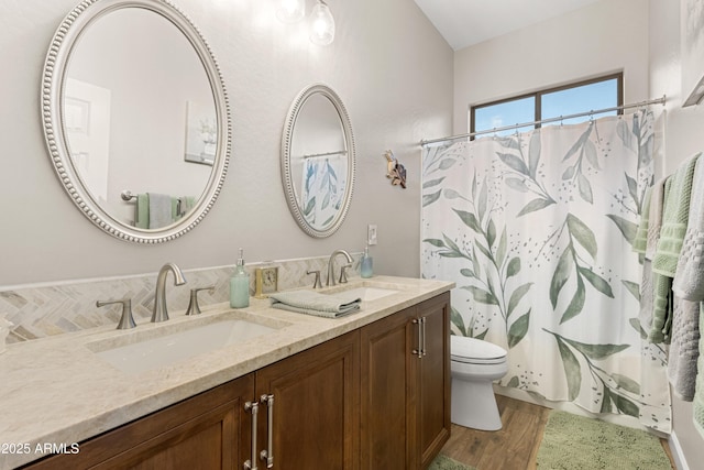 bathroom featuring vanity, hardwood / wood-style floors, toilet, and a shower with shower curtain