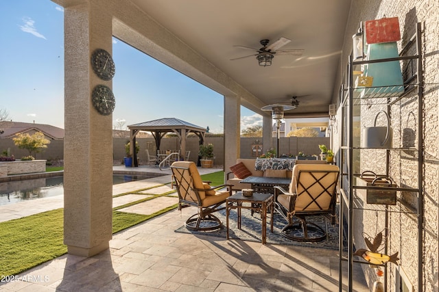 view of patio with a gazebo and ceiling fan