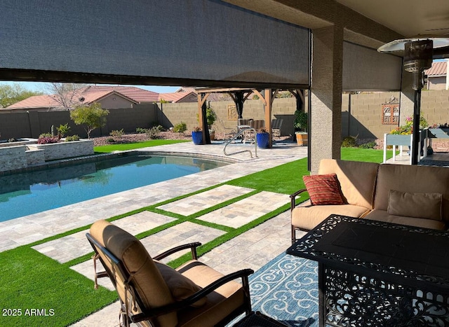 view of swimming pool with an outdoor living space and a patio