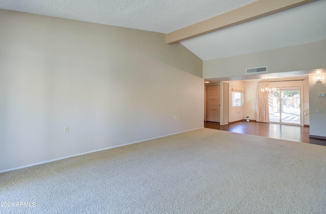 empty room featuring vaulted ceiling with beams, a chandelier, a textured ceiling, and wood-type flooring