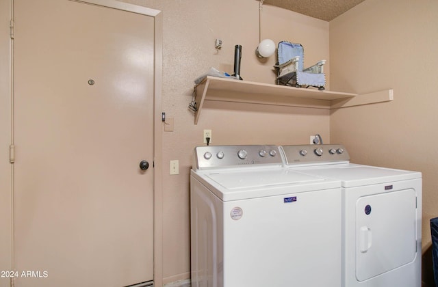 laundry area with washing machine and dryer