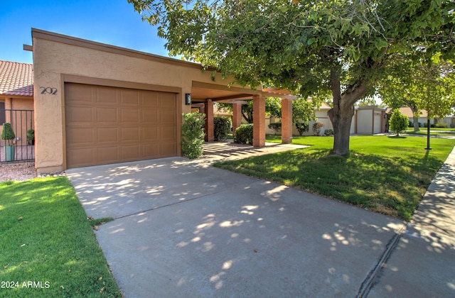 view of front of house with a garage and a front lawn