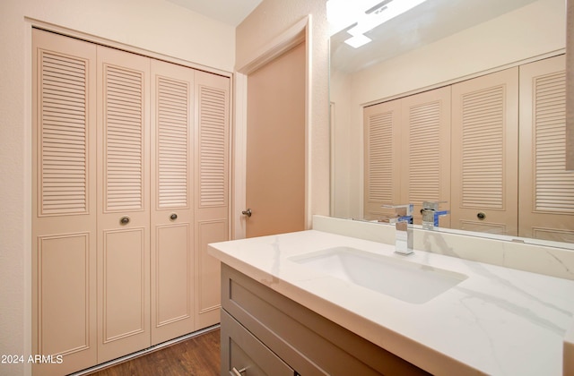 bathroom with wood-type flooring and vanity