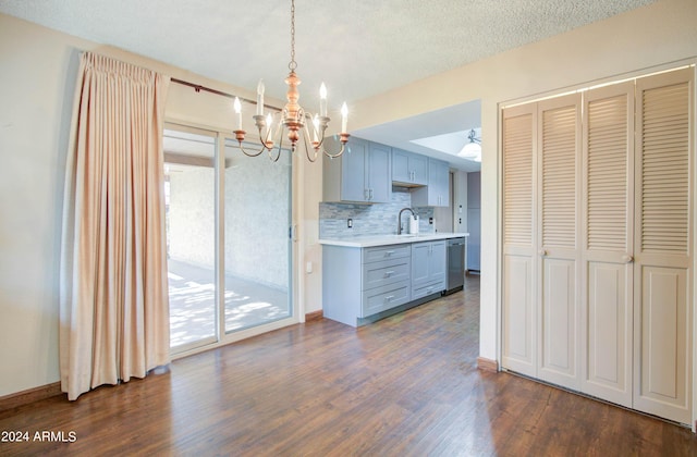 interior space with sink, an inviting chandelier, and dark wood-type flooring