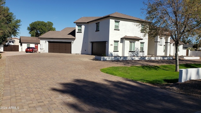2060 E Quartz St, Mesa, AZ 85213 - view of front of home with stucco siding, an attached garage, and decorative driveway