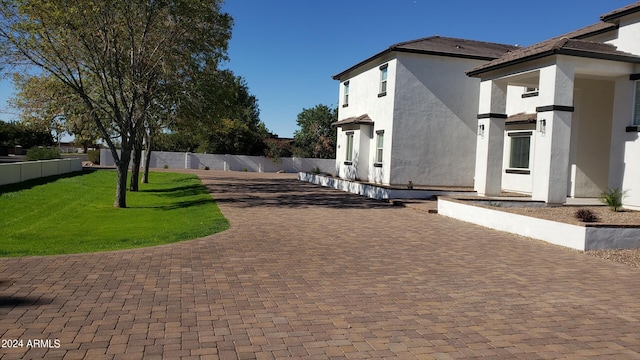 2060 E Quartz St, Mesa, AZ 85213 - view of side of property featuring a patio area, stucco siding, and driveway