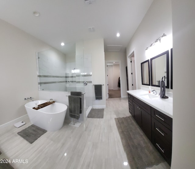 2060 E Quartz St, Mesa, AZ 85213 - full bath with walk in shower, vanity, a freestanding bath, baseboards, and recessed lighting
