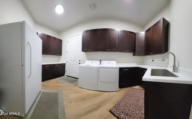 2060 E Quartz St, Mesa, AZ 85213 - laundry area with cabinet space, washing machine and clothes dryer, and light wood-style floors
