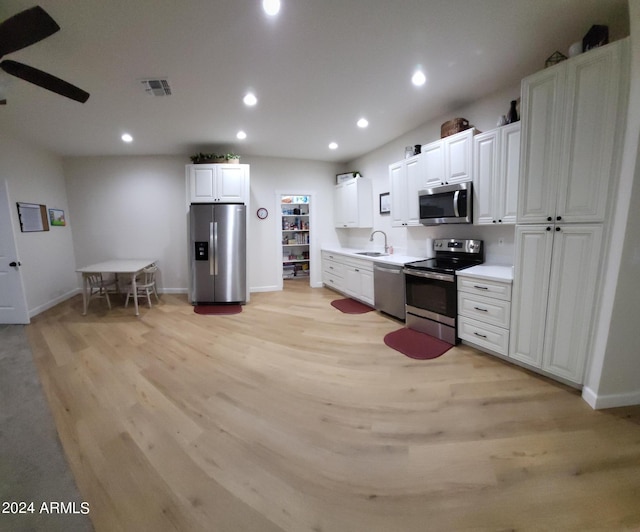 2060 E Quartz St, Mesa, AZ 85213 - kitchen featuring appliances with stainless steel finishes, a sink, light wood-style flooring, baseboards, and recessed lighting