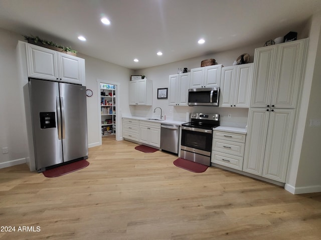 2060 E Quartz St, Mesa, AZ 85213 - kitchen featuring appliances with stainless steel finishes, baseboards, light countertops, recessed lighting, and a sink