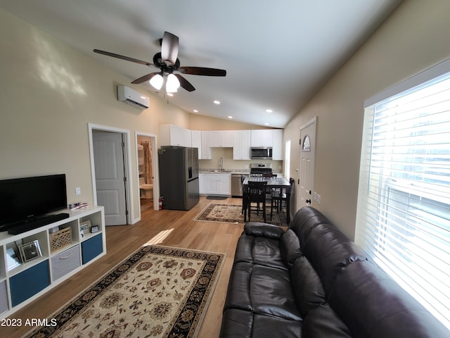 2060 E Quartz St, Mesa, AZ 85213 - living room with vaulted ceiling, an AC wall unit, a ceiling fan, light wood-style floors, and recessed lighting