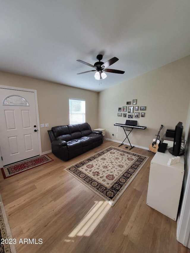 2060 E Quartz St, Mesa, AZ 85213 - living room featuring wood finished floors, a ceiling fan, and baseboards