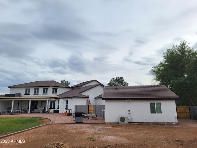 2060 E Quartz St, Mesa, AZ 85213 - back of property featuring a cooling unit, a patio area, and stucco siding