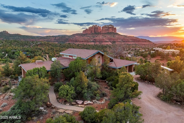 aerial view at dusk with a mountain view