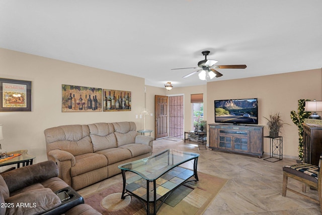 living area featuring a ceiling fan